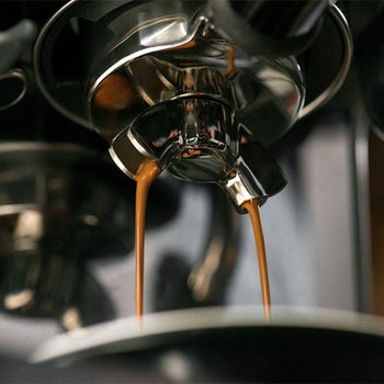 A user interacting with the machine’s touch screen, selecting coffee settings.