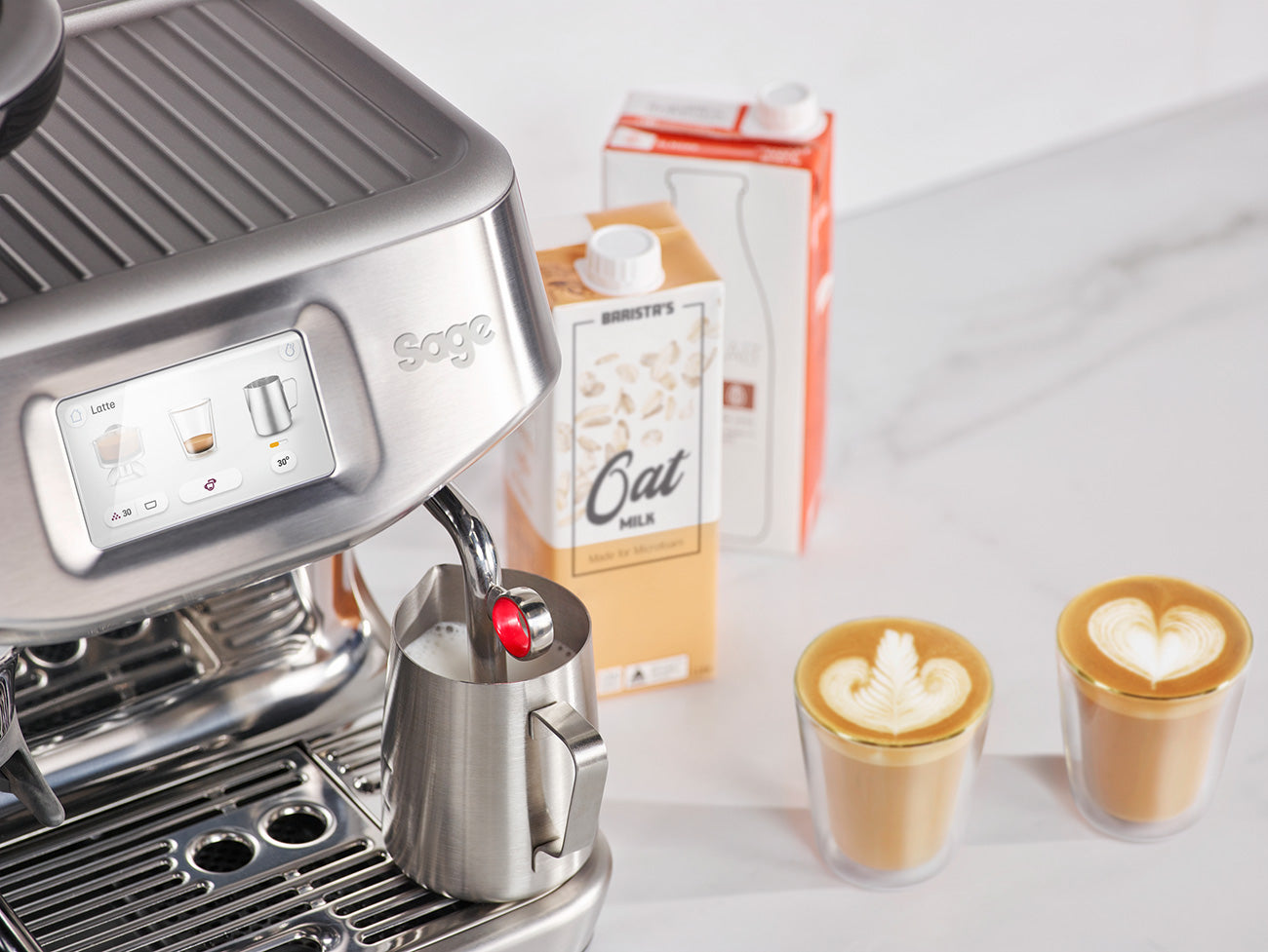 Barista Touch Impress machine with integrated steam wand for microfoam milk texturing