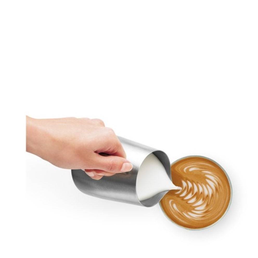 Close-up of the stainless steel portafilter with ground coffee