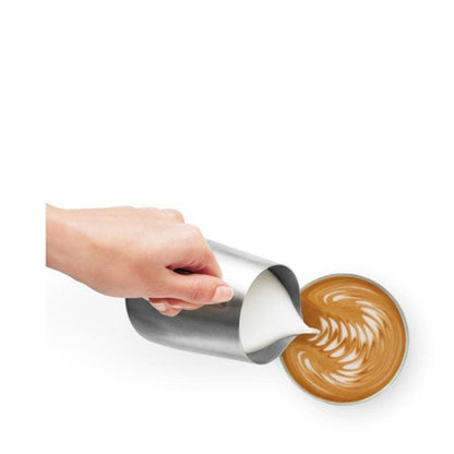 Close-up of the stainless steel portafilter with ground coffee