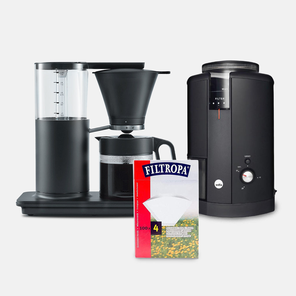 "Wilfa Classic Tall Coffee Maker in black with water and coffee brewing"