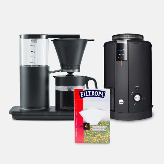 "Wilfa Classic Tall Coffee Maker in black with water and coffee brewing"